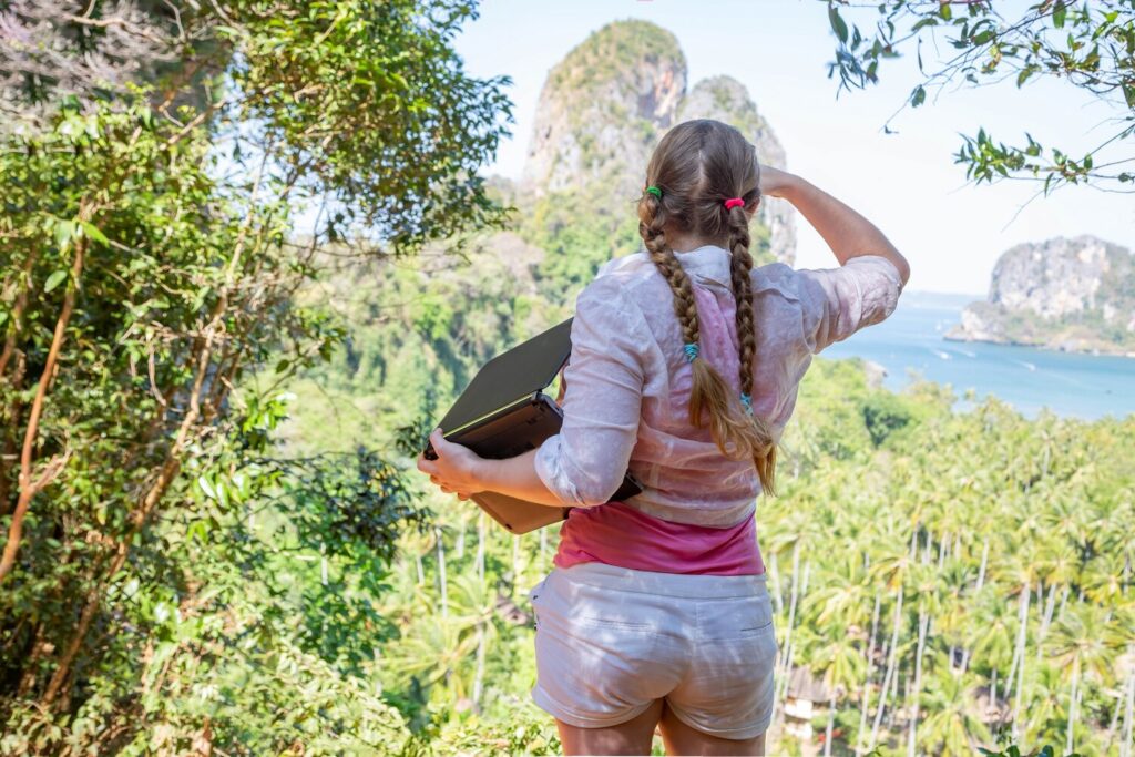 Woman with laptop top mountain looks distancetourist industry worker work tourist place 520119 396 Woman with laptop top mountain looks distancetourist industry worker work tourist place 520119 396